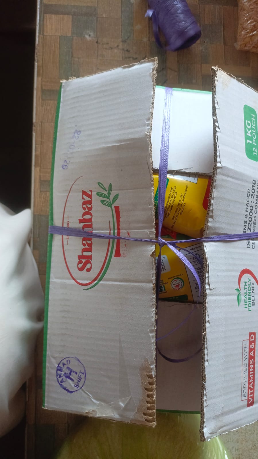 Sealed and labeled food ration donation boxes prepared by Fatima Hope Foundation for relief distribution.